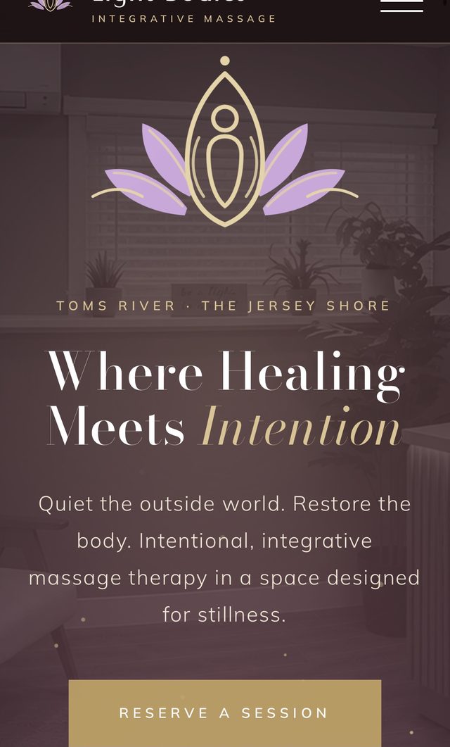Light Bodies Integrative Massage website on a phone